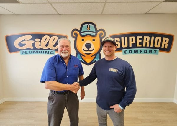 Jim and Scott standing next to each other signaling the uniting of the teams